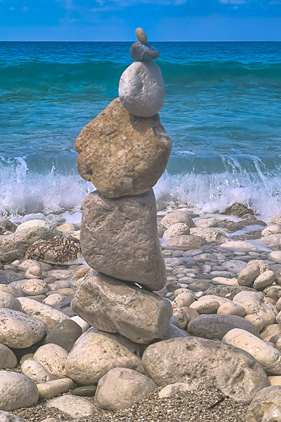 istock Made of stone tower on the beach. Balanced pebbles on beach 2245813309