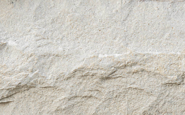 istock [4k] Close-up of White Crushed Stone Texture 2245815698