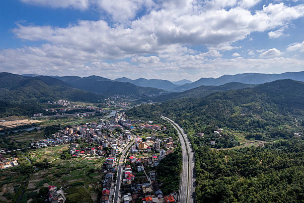istock On a sunny day, overlooking the highway passing through the town 2245815978