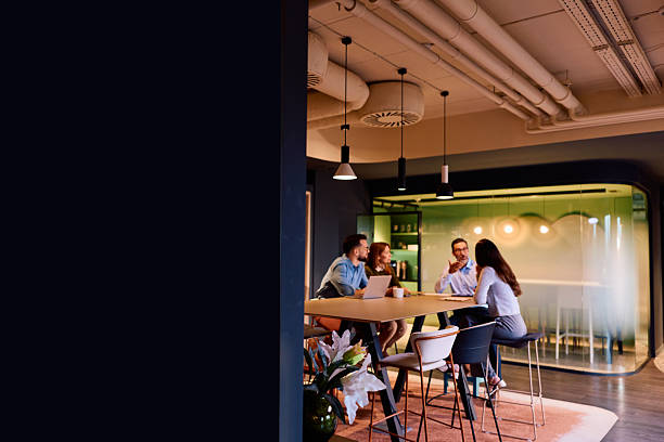 istock Business colleagues collaborating in modern office meeting space 2245818472