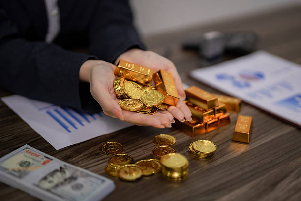 istock Financial professional hands display gold bars coins representing wealth management investment strategy asset security capital growth future planning 2245819871
