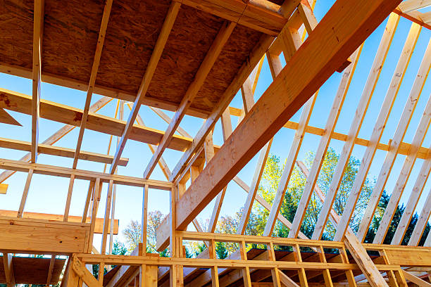 istock New house construction underway with exposed wooden framework 2245820010