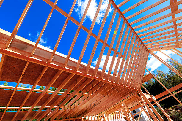 istock Construction site with wooden beams framed being rafters to installed 2245820032