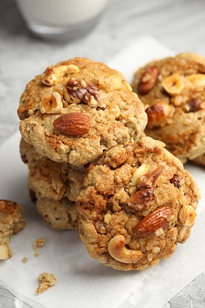 istock Tasty cookies with nuts on table, closeup 2245821476
