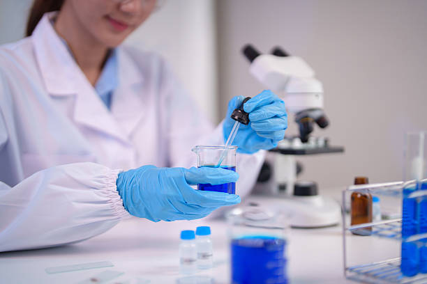 istock Asian woman scientist performs laboratory chemical experiment precise liquid handling modern research facility medical scientific discovery development 2245821811