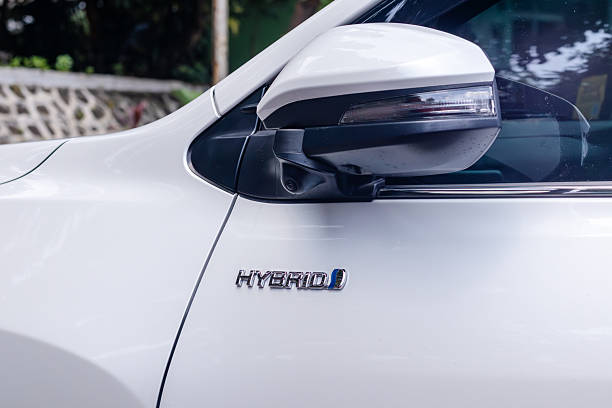 istock Hybrid emblem on the white car 2245823506