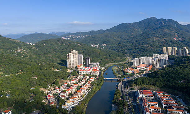 istock Real estate development, red roofed villa area by the water's edge 2245823737