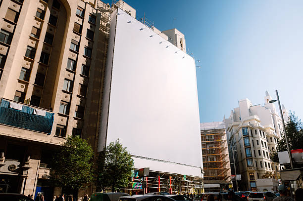 istock Blank billboard covering a building facade 2245827835