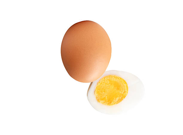 istock Front view of raw brown chicken eggs and cooked or boiled chicken egg with egg yolk in half in stack isolated on white background with clipping path 2245830343