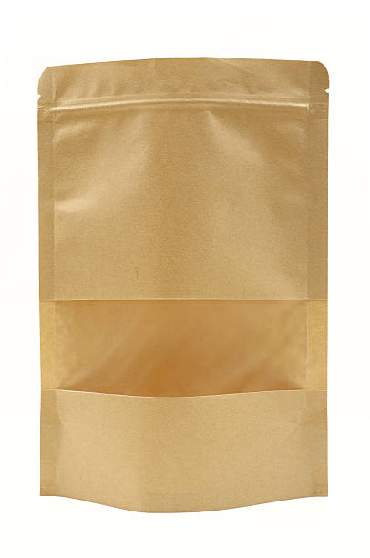 istock Brown paper doypack isolated on white background. Template mock up bag with transparent hole window 2245834459
