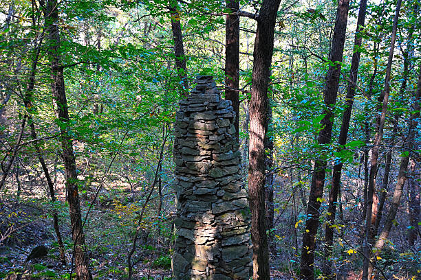 A stone tower built up by people in the forest