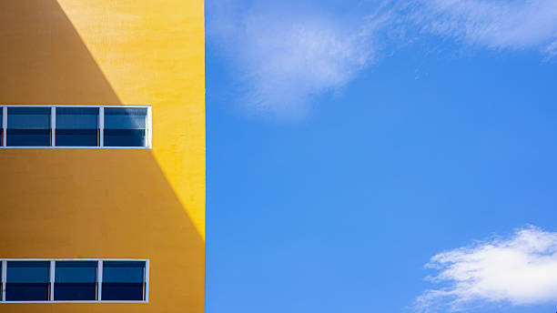 istock Minimal Yellow Building with Blue Sky Background and Modern Architecture Design 2245835892