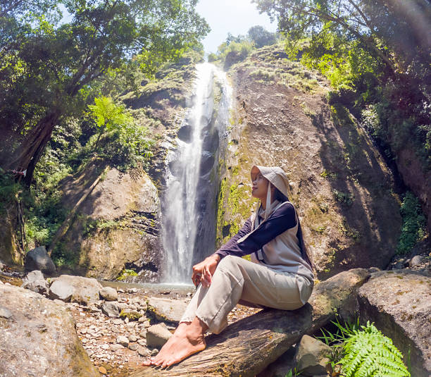 istock Asian woman vacation at Dolo waterfall. One of beautiful waterfall in East Java 2245843949