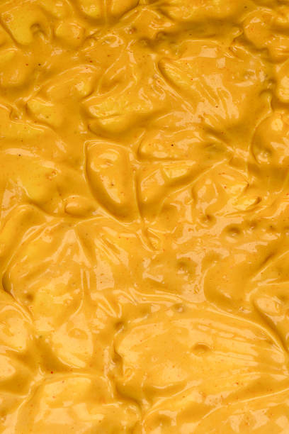 istock Yellow sauce splashes as a background. 2245847213