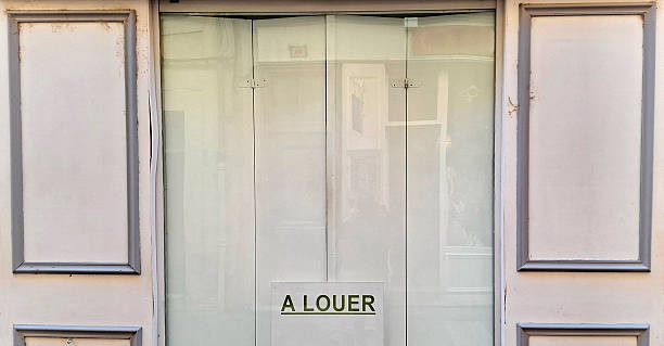 istock French vacancy sign in shop window 2245850803