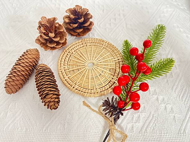 istock Beautiful Arrangement of Natural Pine Cones and Decorative Elements on a Textured White Surface for Seasonal Decor and Craft Projects 2245851117