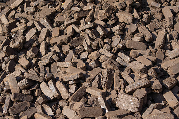 istock Peat briquettes are arranged on a surface, showcasing their texture and form, used as a renewable energy source in various communities 2245856274