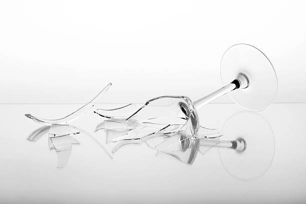 istock Pieces of broken wine glass on white background 2245858135