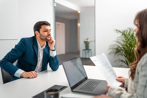 istock Multiracial Young Man in Nervous Conversation with Middle Eastern Woman During Job Interview 2245868409