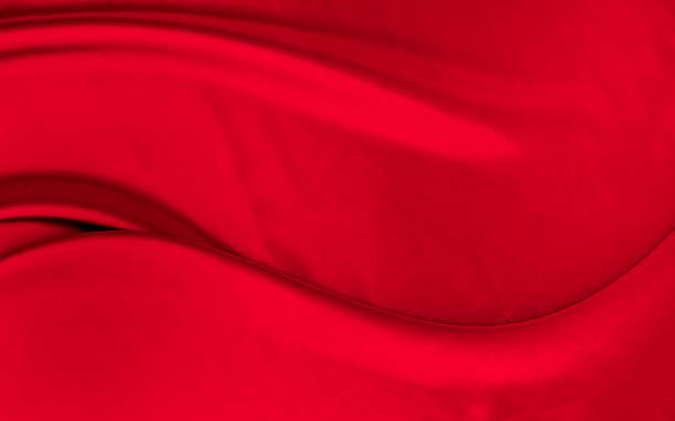 istock Black red satin dark fabric texture luxurious shiny that is abstract silk cloth background with patterns soft waves blur beautiful. 2245869210