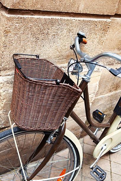 istock Parking an urban bicycle against a stone wall 2245870105