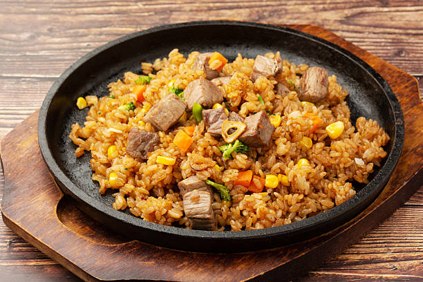 istock Fried rice topped with diced steak 2245870593