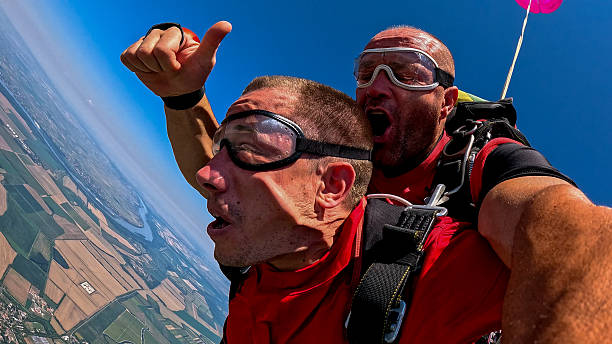 istock Tandem skydivers capture a thrilling selfie during freefall with spectacular earth panorama below 2245872292
