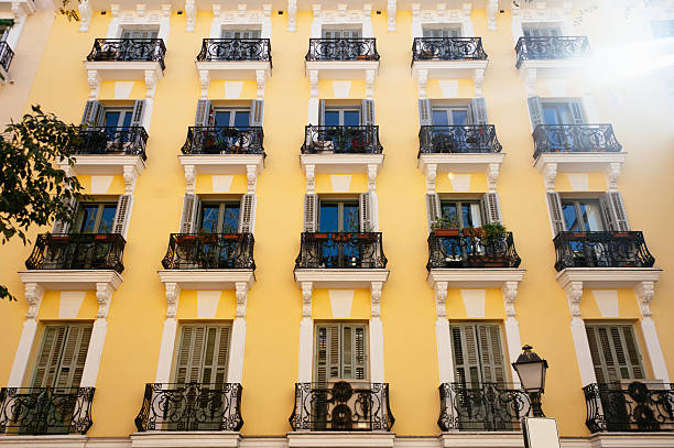 A classical style, colorful apartment building with balconies in Madrid, Spain