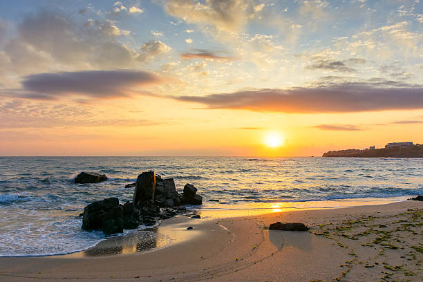 istock sunrise at the beach with gorgeous sky 2245877307