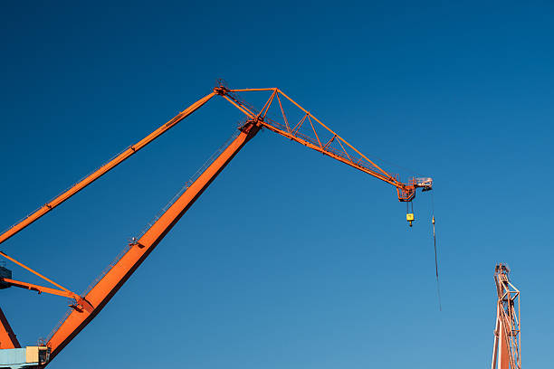 Large orange gantry crane detailed closeup shot.