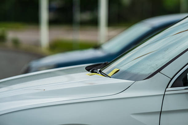 istock Parking Ticket On Windshield Of White Car.. 2245883677