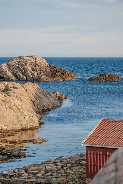 istock Person standing on rocky path near shoreline.. 2245884526