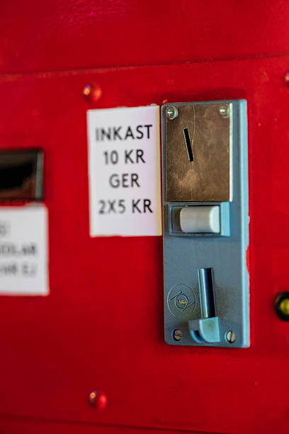 istock Coin slot mechanism on red vending machine.. 2245884854