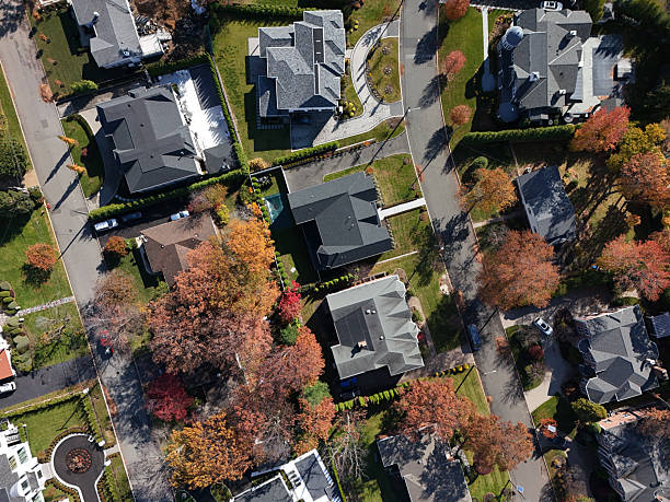 istock Affluent neighborhood rooftops in fall shot straight down 2245885025