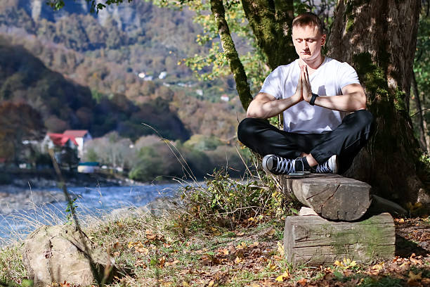 istock Man practicing prayer hand meditation in mountain view 2245887691