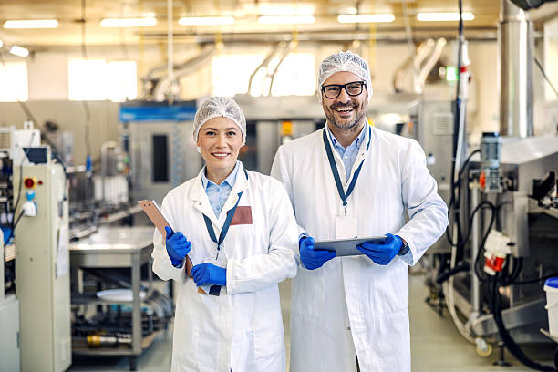 istock Food factory managers smiling during quality control inspection 2245890777
