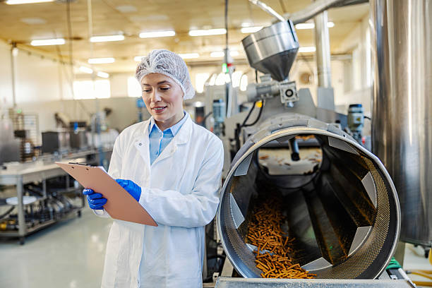 istock Female worker doing quality control in food factory 2245890958