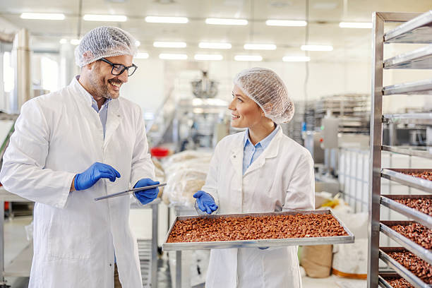 istock Food factory workers inspecting production and quality control 2245891172