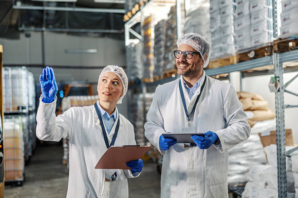 istock Food factory workers inspecting inventory in warehouse 2245891448