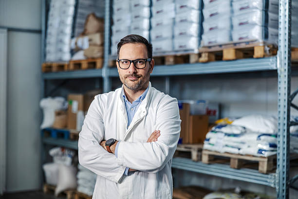 istock Male scientist in lab coat standing in warehouse 2245891524