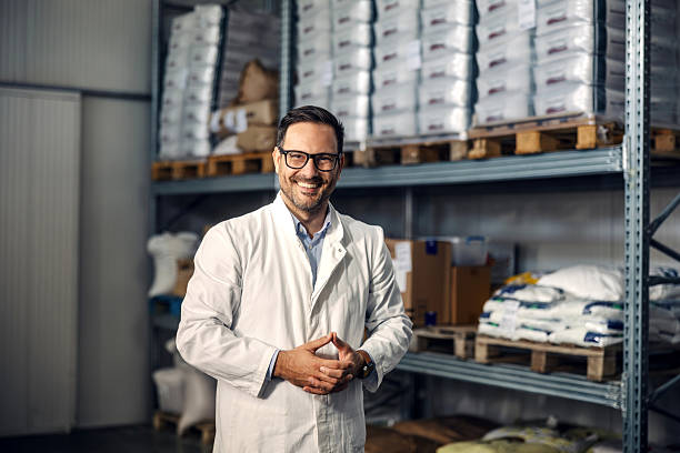 istock Professional man smiling in warehouse with stored goods 2245891525