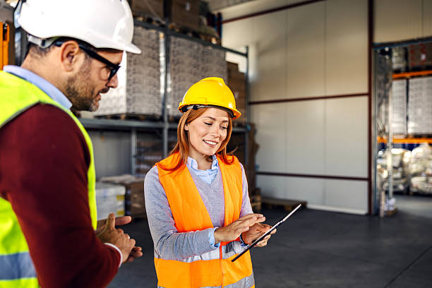 istock Warehouse colleagues discussing logistics and managing inventory using tablet 2245891747