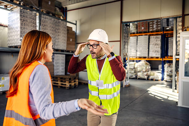 istock Warehouse manager reacting in shock during argument with female worker 2245892411