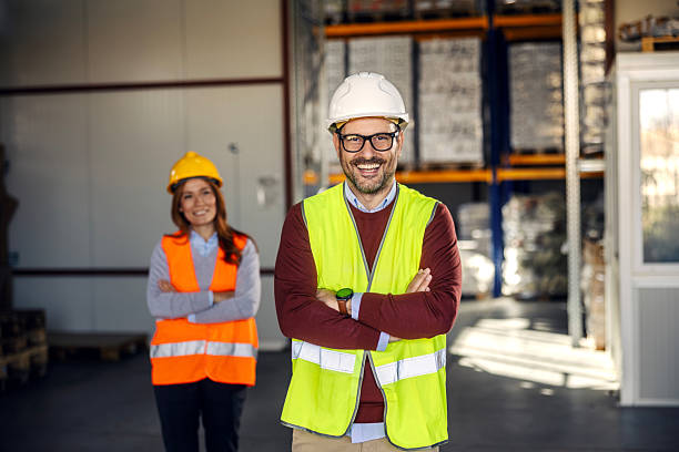 istock Warehouse team members smiling in industrial facility 2245892426