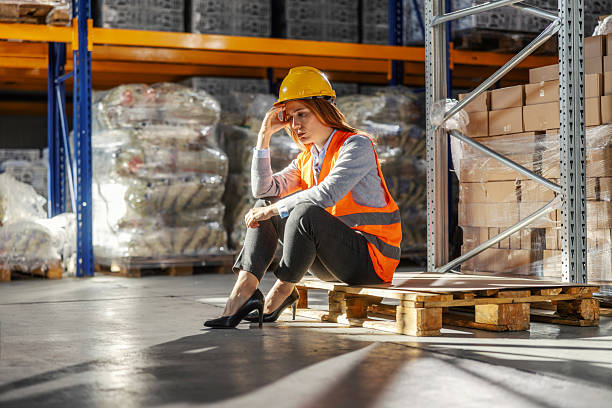 istock Female warehouse manager experiencing stress and burnout 2245892441