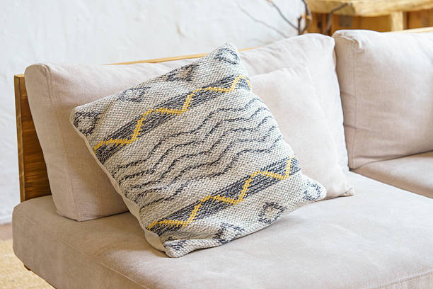 istock Cozy textured pillow, decorative cushion with geometric pattern on beige sofa, natural home interior 2245895361