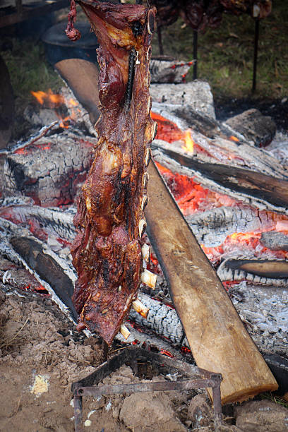 Traditional gaucho-style meat roasting on the stake