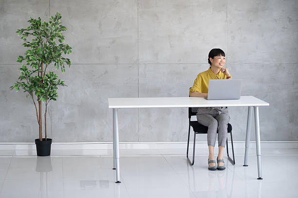 istock Female professional working and thinking at her desk 2245907623