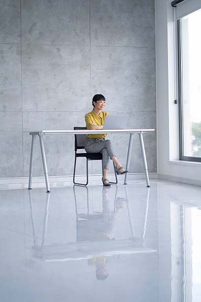 istock Smiling professional taking a call in a bright office 2245907626
