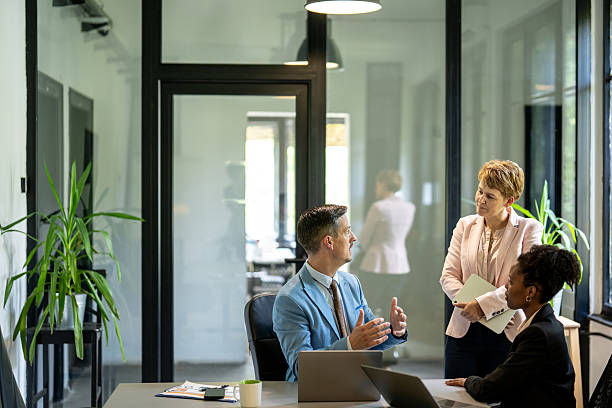 istock Business professionals engaging in office discussion 2245907833